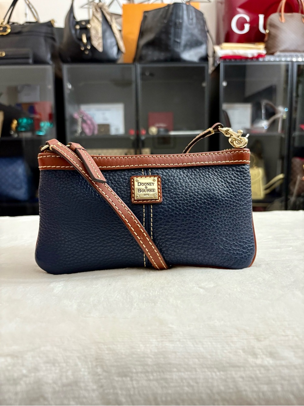 Dooney & Bourke Large Slim Cell Phone Wristlet – Navy Blue Pebble Grain Leather.